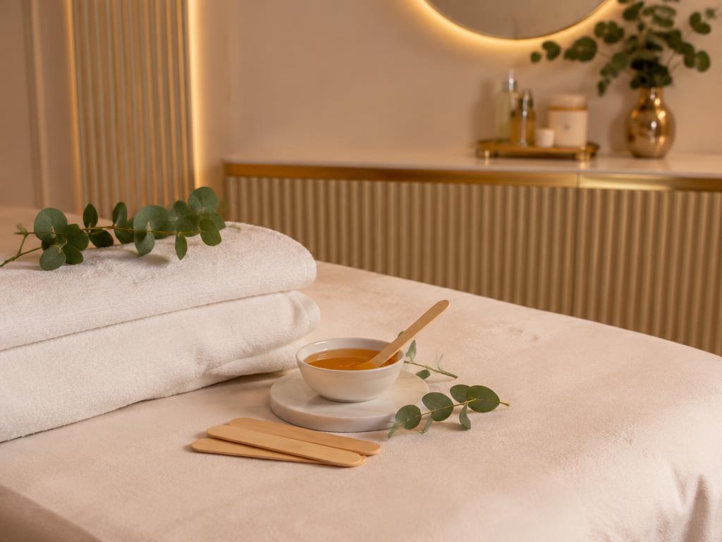 Relaxed client with smooth skin after professional waxing at Bellavue Beauty Salon JVC Dubai